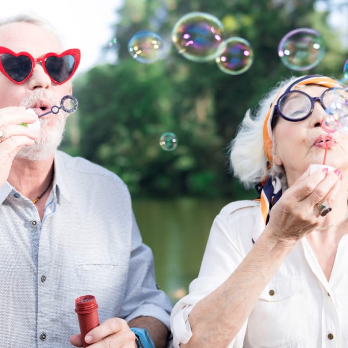 seniors blowing bubbles - square